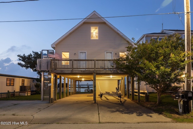 241 Moonlight Dr, Atlantic Beach, NC 28512 - view of front of property featuring a carport, driveway, and a wooden deck