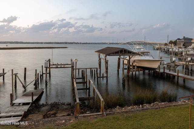 241 Moonlight Dr, Atlantic Beach, NC 28512 - dock featuring boat lift and a water view
