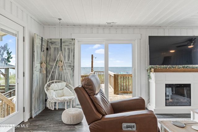 1001 W Beach Dr, Oak Island, NC 28465 - sunroom / solarium featuring wood finished floors and wood ceiling
