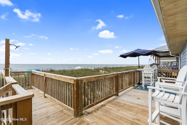 1001 W Beach Dr, Oak Island, NC 28465 - deck featuring view of water and beach