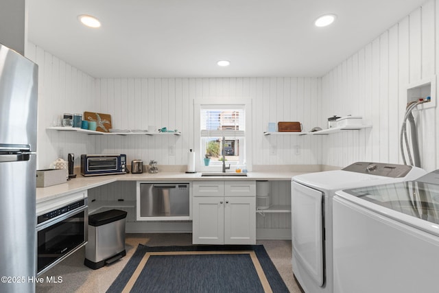 1001 W Beach Dr, Oak Island, NC 28465 - laundry area with washer and dryer and recessed lighting