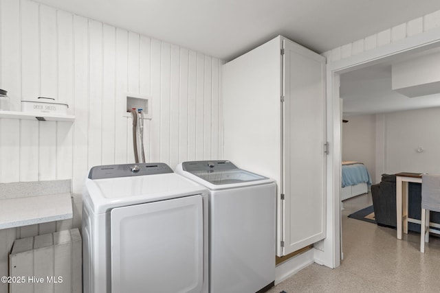 1001 W Beach Dr, Oak Island, NC 28465 - laundry room featuring cabinet space and washing machine and clothes dryer
