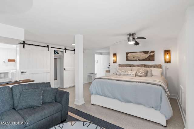1001 W Beach Dr, Oak Island, NC 28465 - bedroom featuring a barn door, carpet floors, baseboards, and ceiling fan