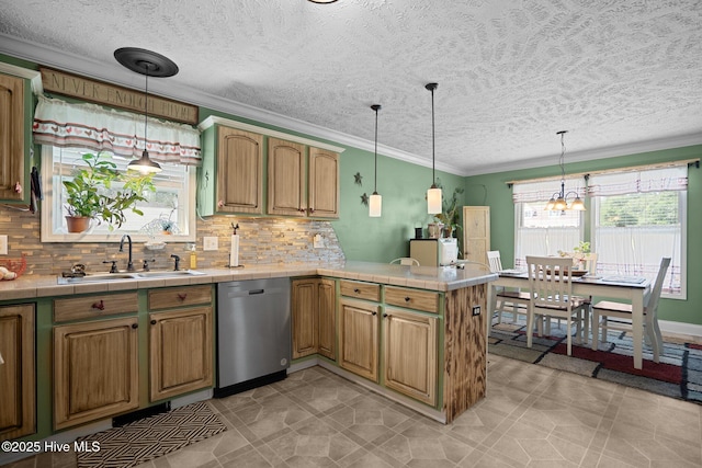 710 Ridgecrest Ln, Rocky Point, NC 28457 - kitchen with dishwasher, a sink, tile countertops, a peninsula, and backsplash