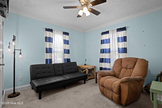 710 Ridgecrest Ln, Rocky Point, NC 28457 - living room featuring a textured ceiling, ornamental molding, ceiling fan, and carpet flooring