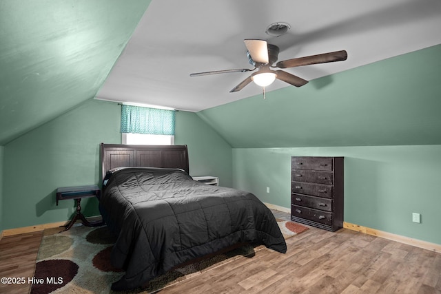 710 Ridgecrest Ln, Rocky Point, NC 28457 - bedroom featuring wood finished floors, baseboards, lofted ceiling, and ceiling fan