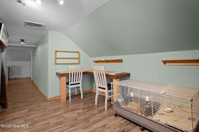 710 Ridgecrest Ln, Rocky Point, NC 28457 - home office featuring wood finished floors, lofted ceiling, and baseboards