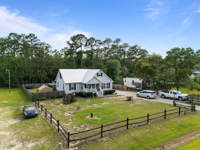 710 Ridgecrest Ln, Rocky Point, NC 28457 - view of front facade featuring covered porch and metal roof