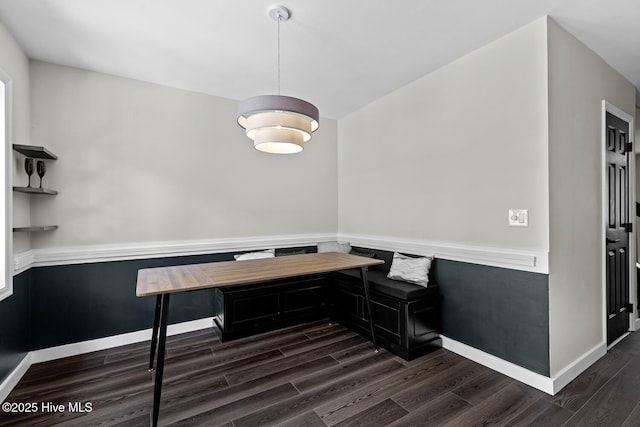 648 Cobblestone Dr, Wilmington, NC 28405 - dining room with dark wood-type flooring, a wainscoted wall, and baseboards