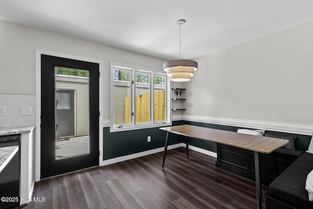 648 Cobblestone Dr, Wilmington, NC 28405 - dining area with dark wood-type flooring, baseboards, and wine cooler