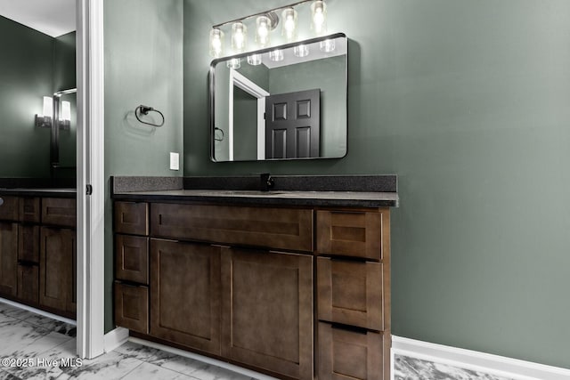 648 Cobblestone Dr, Wilmington, NC 28405 - bathroom with marble finish flooring, vanity, and baseboards
