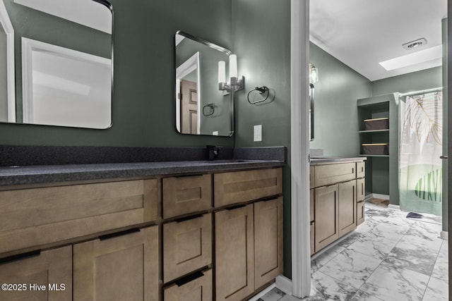 648 Cobblestone Dr, Wilmington, NC 28405 - bathroom with marble finish flooring, vanity, and a shower