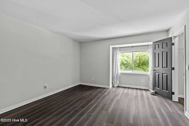 648 Cobblestone Dr, Wilmington, NC 28405 - unfurnished room featuring dark wood-style flooring and baseboards