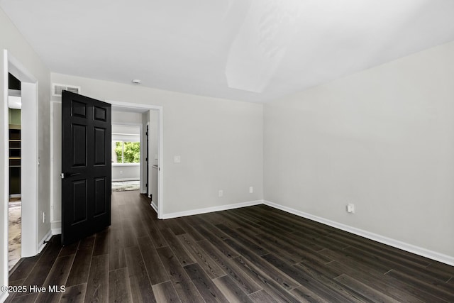 648 Cobblestone Dr, Wilmington, NC 28405 - unfurnished room featuring dark wood finished floors and baseboards