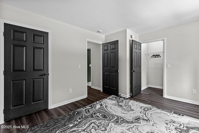 648 Cobblestone Dr, Wilmington, NC 28405 - unfurnished bedroom with wood finished floors and baseboards