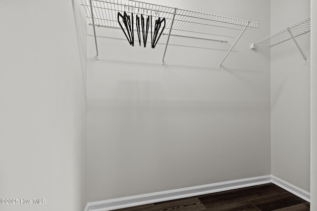 648 Cobblestone Dr, Wilmington, NC 28405 - spacious closet featuring dark wood-type flooring