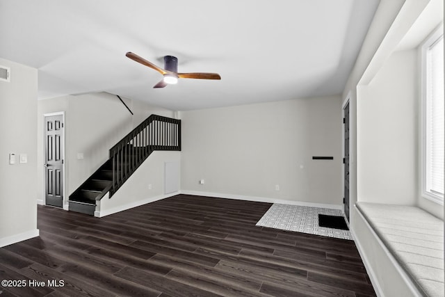 648 Cobblestone Dr, Wilmington, NC 28405 - unfurnished living room featuring stairs, a ceiling fan, wood finished floors, and baseboards