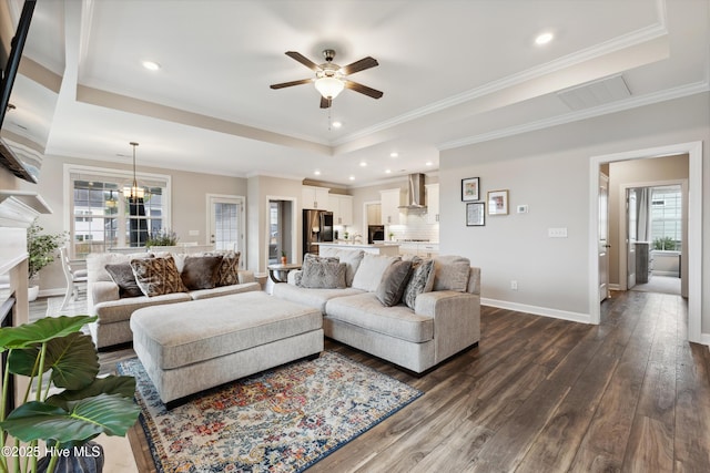 438 Sugar Cove Run, Wilmington, NC 28411 - living area featuring a tray ceiling, ceiling fan, dark wood finished floors, baseboards, and ornamental molding