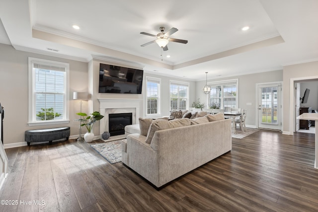 438 Sugar Cove Run, Wilmington, NC 28411 - living room with a raised ceiling, dark wood finished floors, ceiling fan, ornamental molding, and recessed lighting