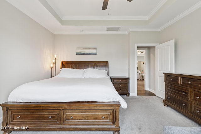 438 Sugar Cove Run, Wilmington, NC 28411 - bedroom featuring a raised ceiling, light colored carpet, crown molding, and a ceiling fan