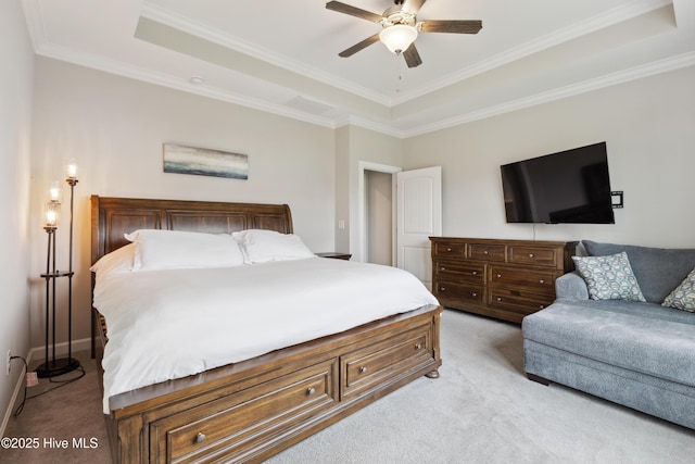 438 Sugar Cove Run, Wilmington, NC 28411 - bedroom with a raised ceiling, light carpet, ornamental molding, a ceiling fan, and baseboards