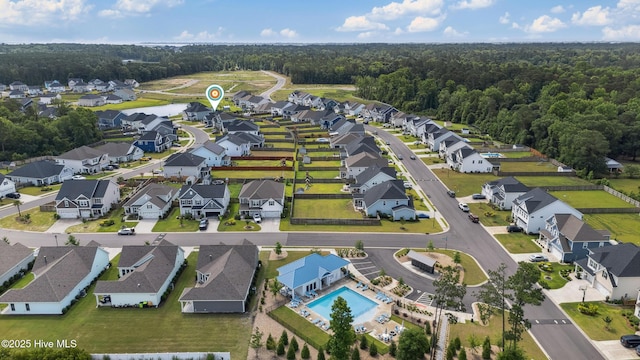 438 Sugar Cove Run, Wilmington, NC 28411 - aerial view of residential area featuring a pool area and a heavily wooded area