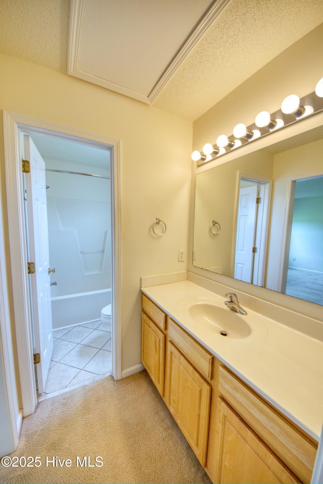 7308 Peppercorn Ct, Wilmington, NC 28411 - full bath with vanity, tile patterned floors, baseboards, and toilet