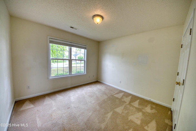 7308 Peppercorn Ct, Wilmington, NC 28411 - carpeted empty room with baseboards and a textured ceiling