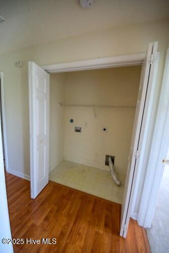 7308 Peppercorn Ct, Wilmington, NC 28411 - washroom with light wood-style flooring and washer hookup