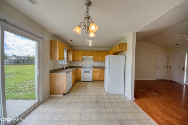 7308 Peppercorn Ct, Wilmington, NC 28411 - kitchen with white appliances, under cabinet range hood, a sink, baseboards, and a chandelier