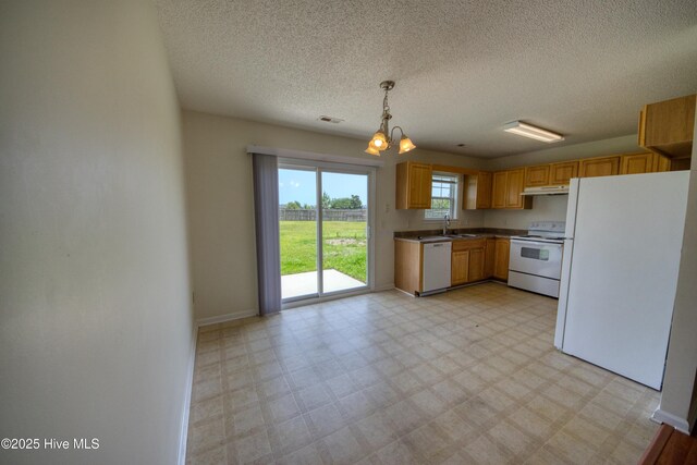 7308 Peppercorn Ct, Wilmington, NC 28411 - kitchen featuring white appliances, a sink, under cabinet range hood, light floors, and baseboards