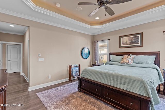 2169 Whiskey Branch Dr, Wilmington, NC 28409 - bedroom with a tray ceiling, dark wood-style flooring, ornamental molding, recessed lighting, and a ceiling fan