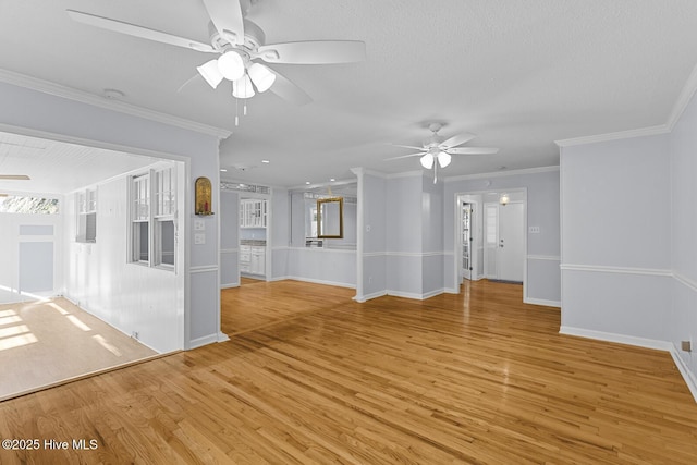 1205 Logan Ct, Jacksonville, NC 28540 - unfurnished living room featuring ceiling fan, light wood-style floors, ornamental molding, and baseboards