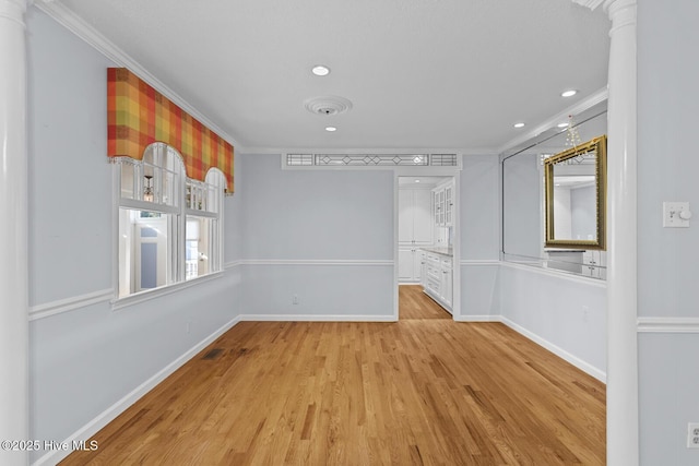 1205 Logan Ct, Jacksonville, NC 28540 - empty room featuring crown molding, light wood-style flooring, baseboards, and recessed lighting