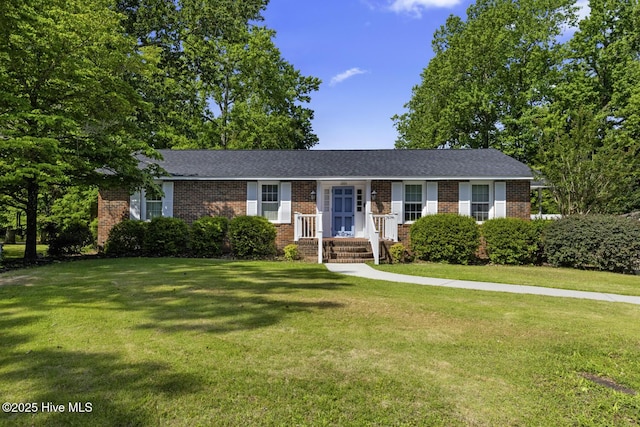 1205 Logan Ct, Jacksonville, NC 28540 - single story home featuring brick siding and a front yard