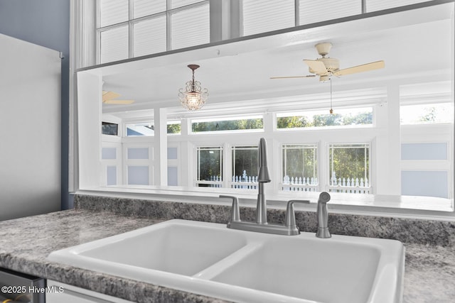 1205 Logan Ct, Jacksonville, NC 28540 - kitchen view of a sink, ceiling fan, and decorative light fixtures