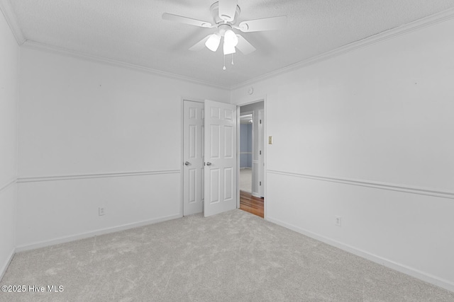 1205 Logan Ct, Jacksonville, NC 28540 - unfurnished bedroom featuring crown molding, a textured ceiling, carpet floors, a ceiling fan, and baseboards