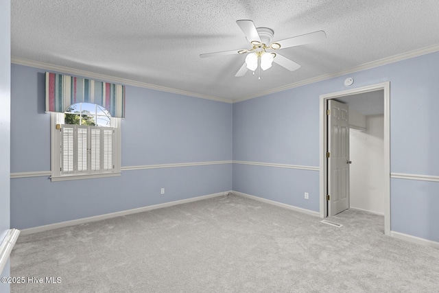 1205 Logan Ct, Jacksonville, NC 28540 - unfurnished bedroom featuring crown molding, carpet, a textured ceiling, baseboards, and a ceiling fan