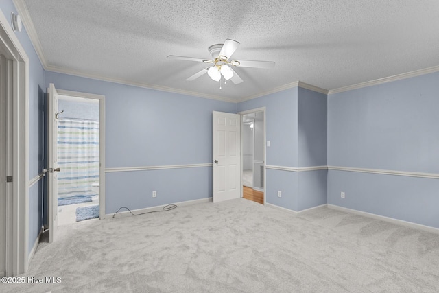 1205 Logan Ct, Jacksonville, NC 28540 - unfurnished bedroom with carpet floors, a textured ceiling, crown molding, baseboards, and ensuite bath