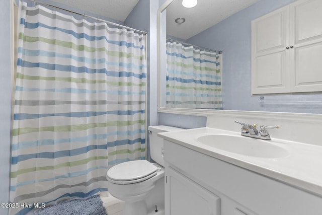 1205 Logan Ct, Jacksonville, NC 28540 - full bathroom featuring toilet, vanity, a textured ceiling, and curtained shower