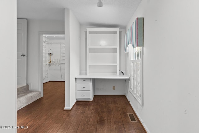 1205 Logan Ct, Jacksonville, NC 28540 - hallway featuring dark wood-type flooring, baseboards, a desk, and stairway