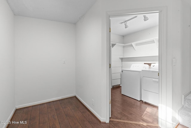 1205 Logan Ct, Jacksonville, NC 28540 - laundry room with washer and clothes dryer, hardwood / wood-style flooring, baseboards, and rail lighting