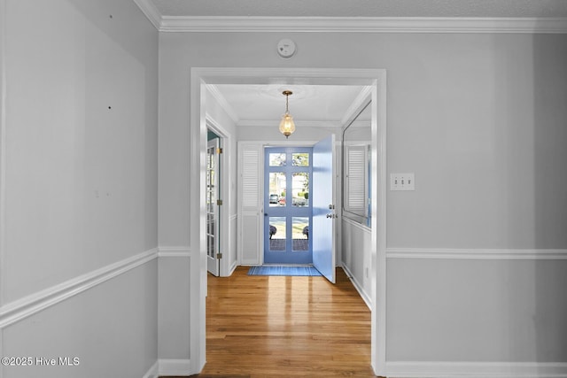 1205 Logan Ct, Jacksonville, NC 28540 - entrance foyer with wood finished floors, french doors, ornamental molding, and baseboards