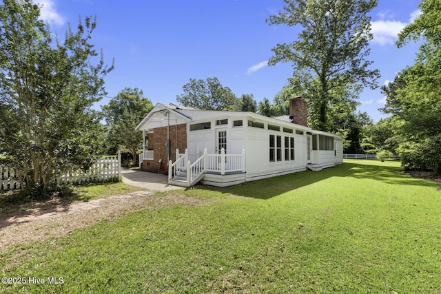 1205 Logan Ct, Jacksonville, NC 28540 - back of property featuring a chimney