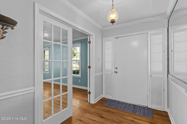 1205 Logan Ct, Jacksonville, NC 28540 - entrance foyer featuring wood finished floors, crown molding, and baseboards