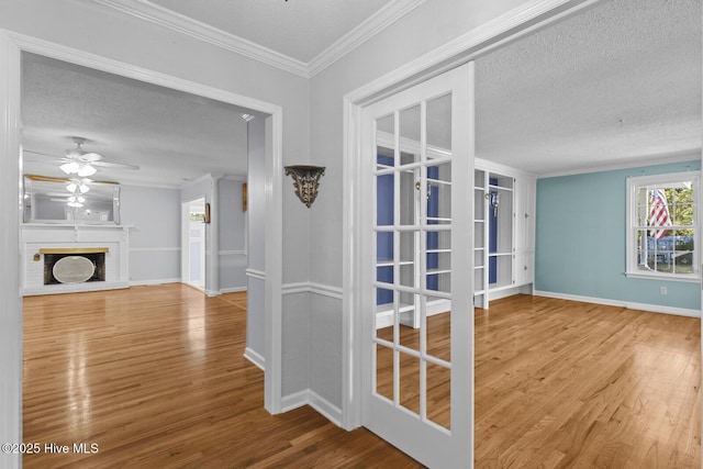 1205 Logan Ct, Jacksonville, NC 28540 - corridor with wood finished floors, a textured ceiling, crown molding, and baseboards