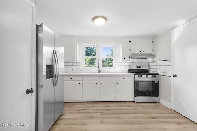 208 Buck Ln, Vanceboro, NC 28586 - kitchen with appliances with stainless steel finishes, under cabinet range hood, backsplash, and white cabinets