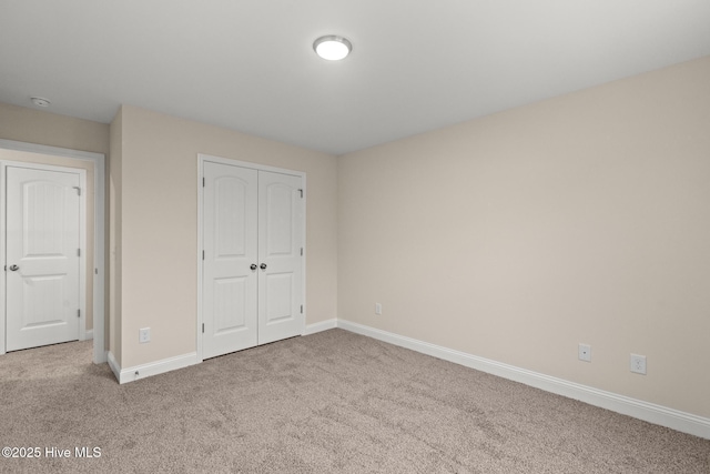 411 Fore Pl, Jacksonville, NC 28540 - unfurnished bedroom featuring carpet, baseboards, and a closet