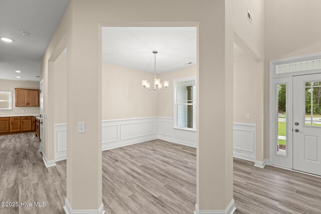 411 Fore Pl, Jacksonville, NC 28540 - foyer entrance featuring light wood-type flooring, a chandelier, wainscoting, and recessed lighting