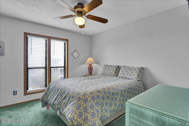 308 N Shore Dr E, Sunset Beach, NC 28468 - carpeted bedroom with baseboards, a ceiling fan, and a textured ceiling